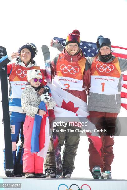 Marie Martinod of France after winning the silver medal celebrates with daughter Melirose along with gold medalist Cassie Sharpe of Canada and bronze...