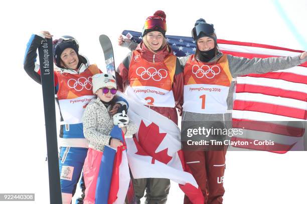 Marie Martinod of France after winning the silver medal celebrates with daughter Melirose along with gold medalist Cassie Sharpe of Canada and bronze...