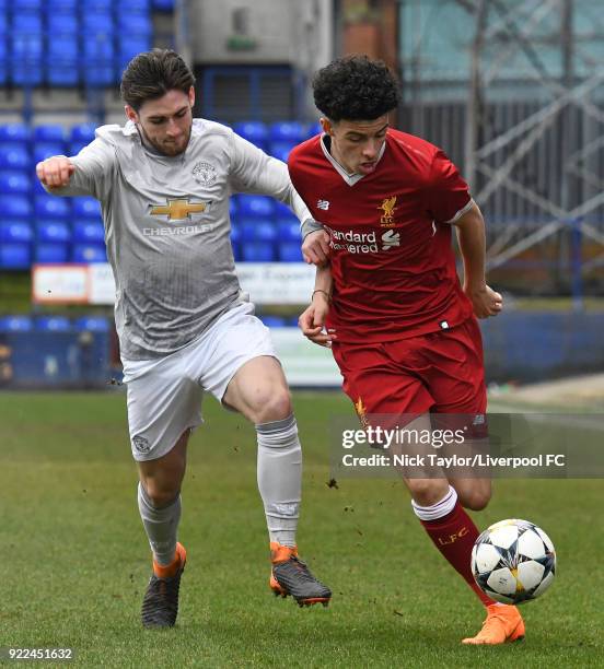 Curtis Jones of Liverpool and Aidy Barlow of Manchester United in action during the Liverpool v Manchester United UEFA Youth League game at Prenton...