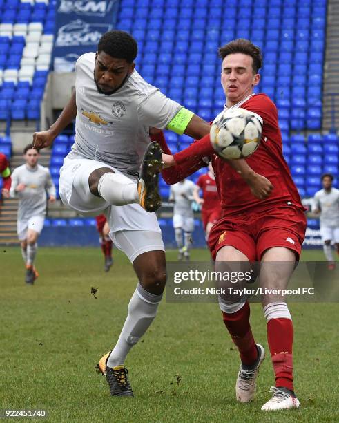Liam Millar of Liverpool and Ro-Shaun Williams of Manchester United in action during the Liverpool v Manchester United UEFA Youth League game at...