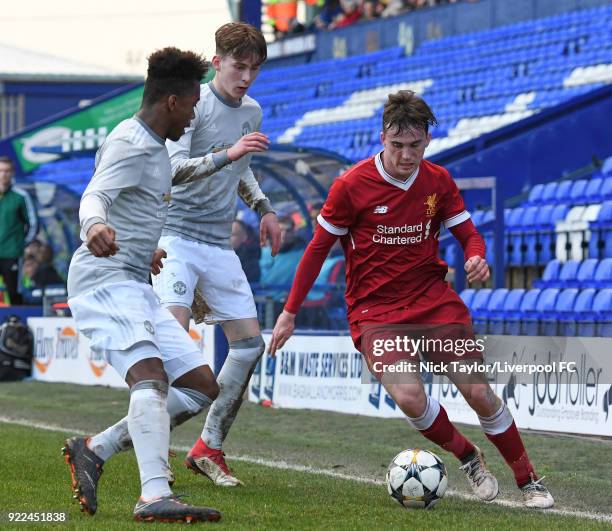 Liam Millar of Liverpool and James Garner and Ethan Laird of Manchester United in action during the Liverpool v Manchester United UEFA Youth League...