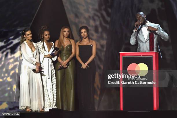 Perrie Edwards, Leigh Anne Pinnock, Jesy Nelson and Jade Thirlwall of Little Mix present Stormzy with the Best British Male Solo Artist award at The...