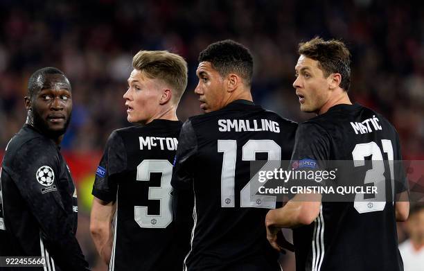 Manchester United's Serbian midfielder Nemanja Matic, defender Chris Smalling, Manchester United's English midfielder Scott McTominay and Belgian...