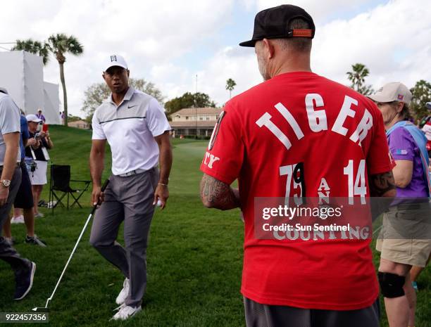 Tiger Woods says hello to his fan Chris Siska of Lake Worth on Wednesday, Feb. 21, 2018 during the Pro-Am round of the Honda Classic at the PGA...