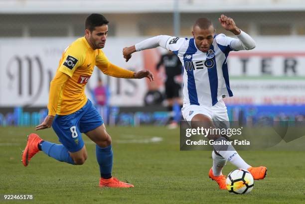 Porto forward Yacine Brahimi from Algeria with GD Estoril Praia midfielder Eduardo Teixeira from Brazil in action during the Primeira Liga match...