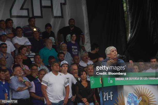 Hugo Moyano, labor leader of the nation's largest trade union CGT, right, speaks during a protest against President Mauricio Marci's economic...