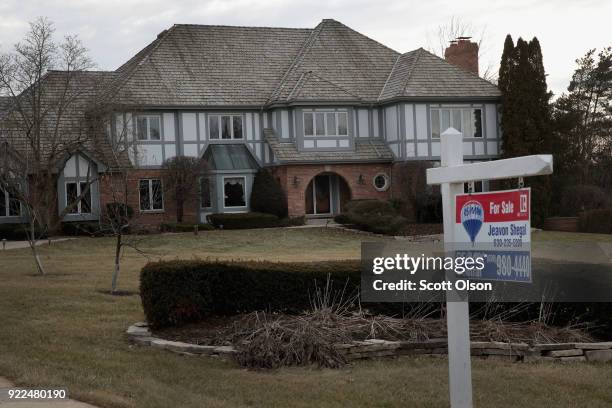 Home is offered for sale on February 21, 2018 in South Barrington, Illinois. January home sales experienced a sharp drop over the same period last...