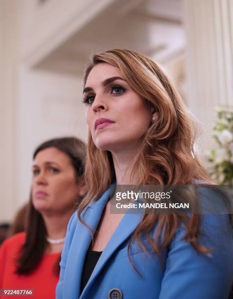 White House Communications Director Hope Hicks watches as US President Donald Trump takes part in a listening session on gun violence with teachers...