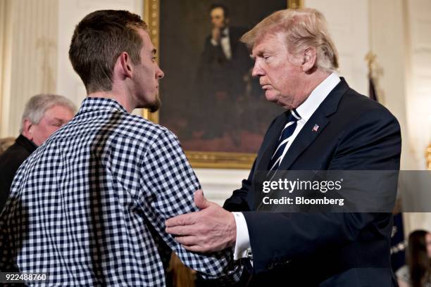 President Donald Trump, right, greets Samuel Zeif, Marjory Stoneman Douglas High School student, at a listening session on gun violence with high...