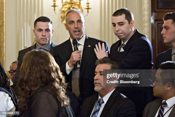 Andrew Pollack, whose daughter Meadow was one of the 17 people killed at Marjory Stoneman Douglas High School, center, speaks during a listening...
