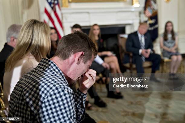 Samuel Zeif, Marjory Stoneman Douglas High School student, cries after speaking at a listening session with U.S. President Donald Trump, second...