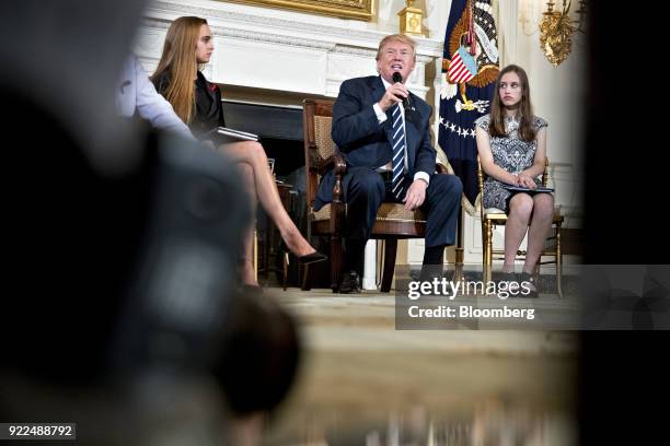 President Donald Trump, center, speaks as Julia Cordover, Parkland student body president, left, and Carson Abt, a student from Marjory Stoneman...