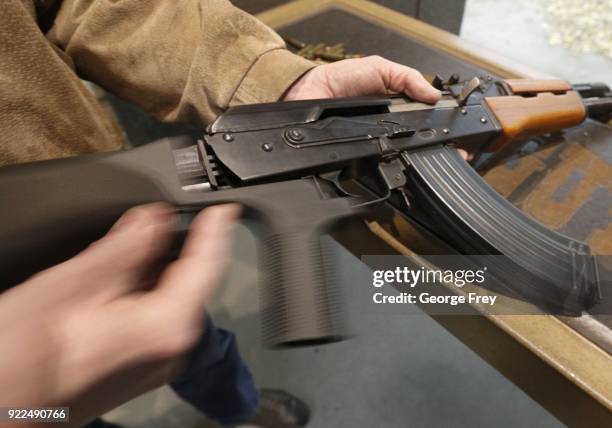 Bump stock is installed on an AK-47 and its movement is demonstrated at Good Guys Gun and Range on February 21, 2018 in Orem, Utah. The bump stock is...