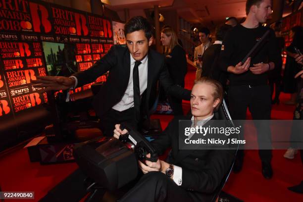 Marius Borg H¿iby Crown Princess of Norway's Son tries to beat Panasonic Jaguar Racing Formula E driver Mitch Evans' lap time on Formula E simulators...