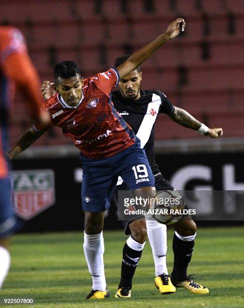 Bolivia's Wilstermann player Gilbert Alvarez vies for the ball with Henrique of Brazil's Vasco Da Gama during their Copa Libertadores football match...