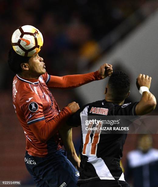 Bolivia's Wilstermann player Juan Pablo Aponte vies for the ball with Paulinho of Brazil's Vasco Da Gama during their Copa Libertadores football...