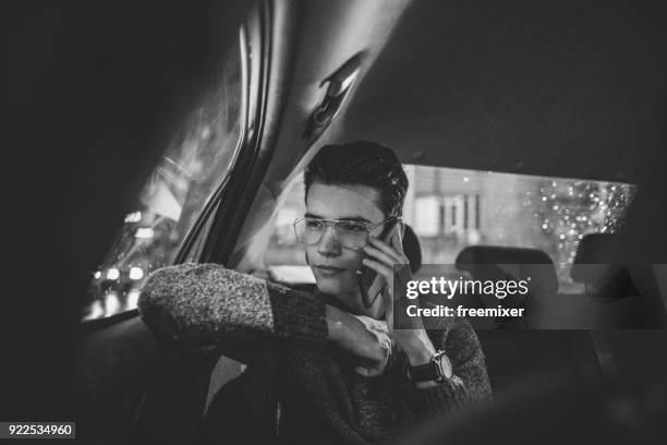 businessman talking on the phone - black and white taxi stock pictures, royalty-free photos & images
