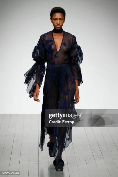 Model walks the runway at the Teatum Jones show during London Fashion Week February 2018 at BFC Show Space on February 20, 2018 in London, England.