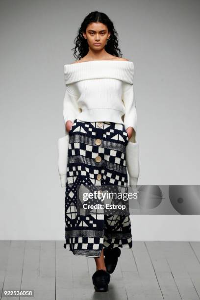 Model walks the runway at the Teatum Jones show during London Fashion Week February 2018 at BFC Show Space on February 20, 2018 in London, England.