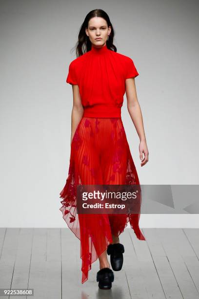 Model walks the runway at the Teatum Jones show during London Fashion Week February 2018 at BFC Show Space on February 20, 2018 in London, England.