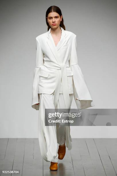 Model walks the runway at the Teatum Jones show during London Fashion Week February 2018 at BFC Show Space on February 20, 2018 in London, England.