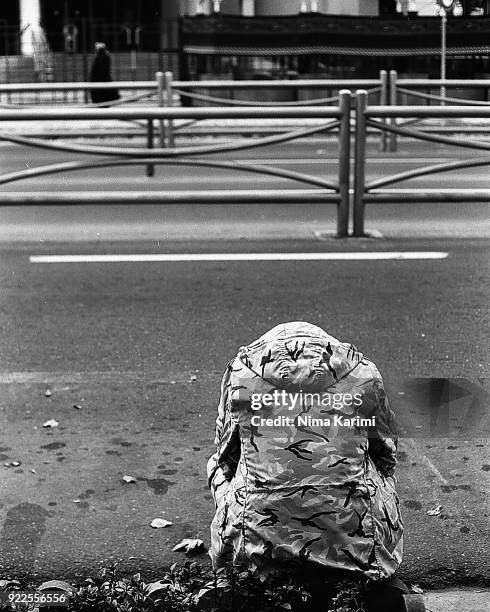 a soldier sitting on a sidewalk with heads down - revolution stock pictures, royalty-free photos & images