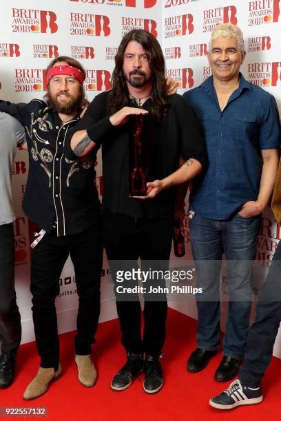 Chris Shiflett, Dave Grohl and Pat Smear of Foo Fighters, winner of the Best International Group award, pose in the winners room during The BRIT...