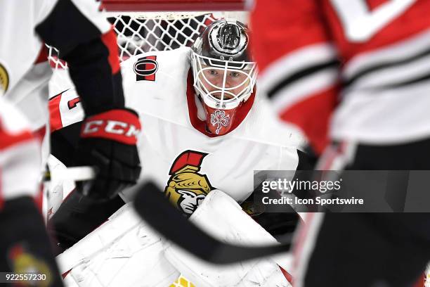 Ottawa Senators goaltender Mike Condon looks through traffic for the puck in the first period of play during a game between the Chicago Blackhawks...