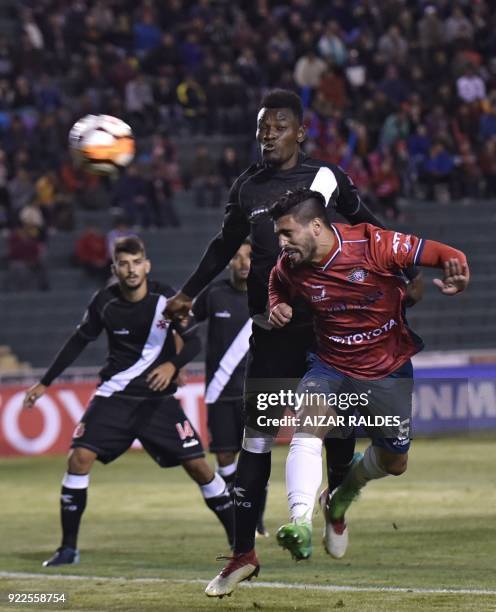 Bolivia's Wilstermann player Lucas Gaucho vies for the ball with Paulao of Brazil's Vasco Da Gama during their Copa Libertadores football match at...