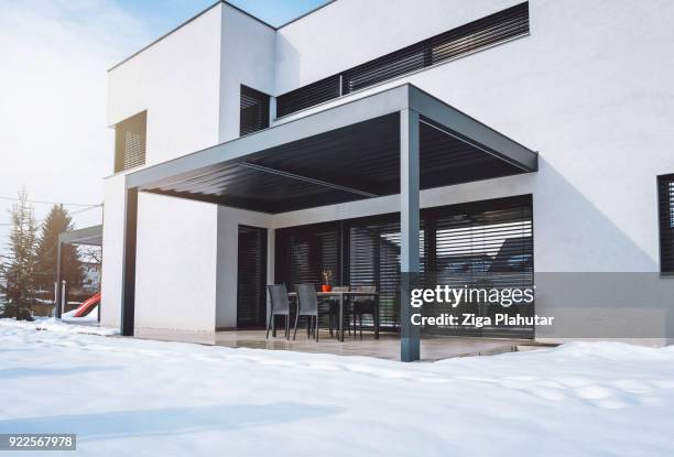 hard roof top pergola over the teracce - facade blinds stock pictures, royalty-free photos & images