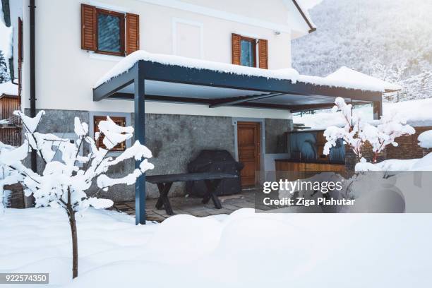 covered teracce in winter fairytale - metal patio table stock pictures, royalty-free photos & images