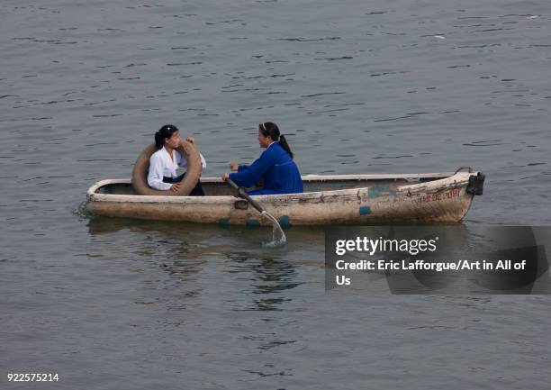 North Korean people in rowing boats on Taedong river, Pyongan Province, Pyongyang, North Korea on September 7, 2008 in Pyongyang, North Korea.