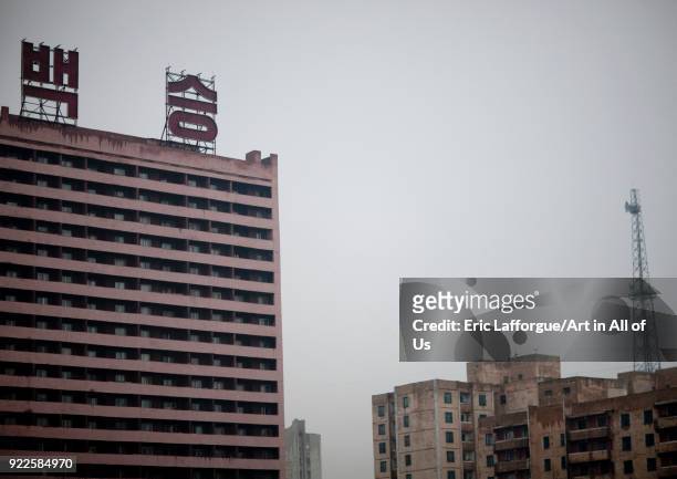 Dilapidated buildings with the slogan 100 fights 100 victories at the top, Pyongan Province, Pyongyang, North Korea on April 26, 2010 in Pyongyang,...