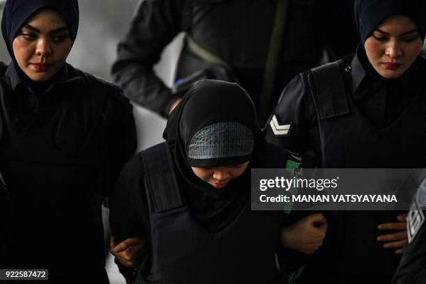 Indonesian national Siti Aisyah is escorted by Malaysian police for another appearance at court for her trial at the Shah Alam High Court in Shah...