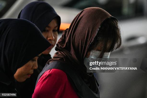 Vietnamese national Doan Thi Huong is escorted by Malaysian police for another appearance at court for her trial at the Shah Alam High Court in Shah...