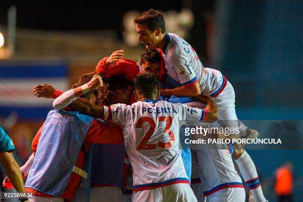Uruguay's Nacional footballers celebrate after scoring against Argentina's Banfield during their Copa Libertadores 2018 3rd stage second leg football...