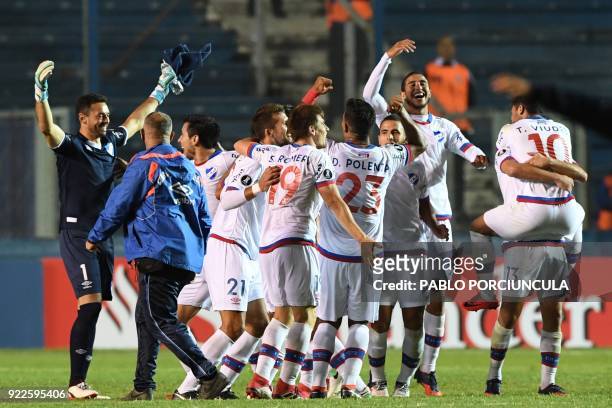 Uruguay's Nacional footballers celebrate after defeating Argentina's Banfield during their Copa Libertadores 2018 3rd stage second leg football match...