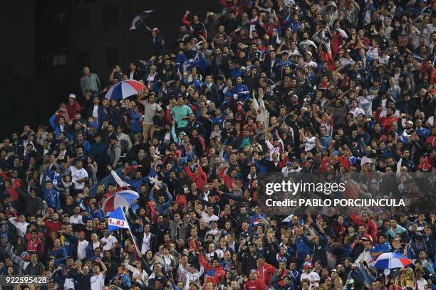 Uruguay's Nacional fans celebrate after defeating Argentina's Banfield during their Copa Libertadores 2018 3rd stage second leg football match at the...