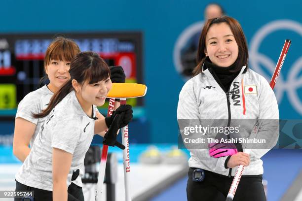 Yumi Suzuki, Yurika Yoshida and Satsuki Fujisawa of Japan are seen in the 1st end during the Women's Curling round robin session 12 between...