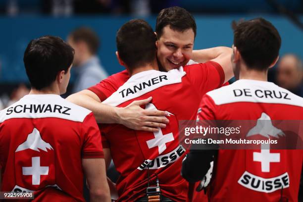 Peter de Cruz, Valentin Tanner, Claudio Patz and Benoit Schwarz of Switzerland celebrate victory after the Curling Men's Tie-breaker against Great...