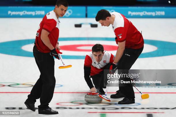 Peter de Cruz, Valentin Tanner, Claudio Patz and Benoit Schwarz of Switzerland conmpete in the Curling Men's Tie-breaker against Great Britain on day...