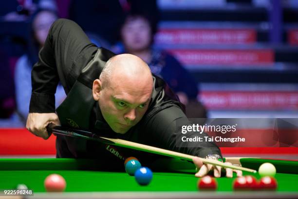 Stuart Bingham of England plays a shot during his first round match against Mark J. Williams of Wales on day three of 2018 Ladbrokes World Grand Prix...