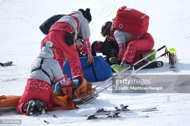 Paramedics attend to Kevin Rolland of France after he crashed during the Freestyle Skiing Men's Ski Halfpipe Final on day thirteen of the PyeongChang...