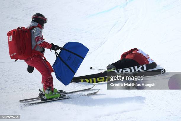 Paramedics attend to Kevin Rolland of France after he crashed during the Freestyle Skiing Men's Ski Halfpipe Final on day thirteen of the PyeongChang...