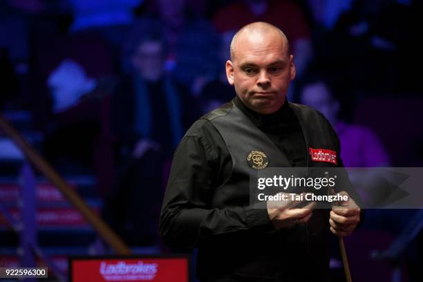 Stuart Bingham of England chalks the cue during his first round match against Mark J. Williams of Wales on day three of 2018 Ladbrokes World Grand...