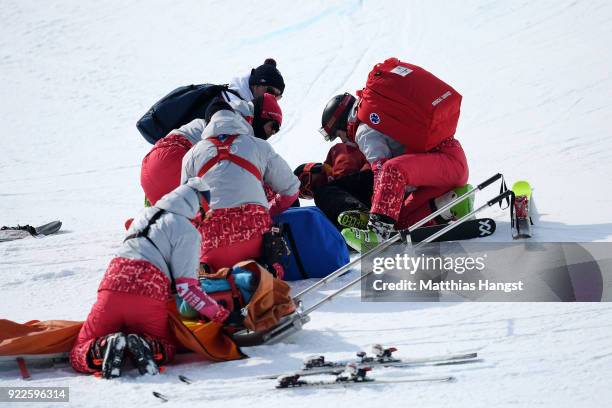 Paramedics attend to Kevin Rolland of France after he crashed during the Freestyle Skiing Men's Ski Halfpipe Final on day thirteen of the PyeongChang...