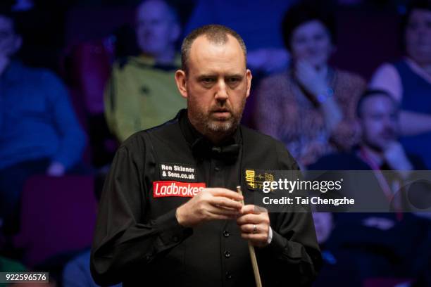 Mark J. Williams of Wales chalks the cue during his first round match against Stuart Bingham of England on day three of 2018 Ladbrokes World Grand...