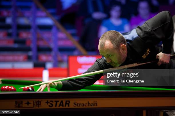 Mark J. Williams of Wales plays a shot during his first round match against Stuart Bingham of England on day three of 2018 Ladbrokes World Grand Prix...