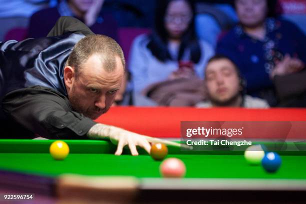 Mark J. Williams of Wales plays a shot during his first round match against Stuart Bingham of England on day three of 2018 Ladbrokes World Grand Prix...