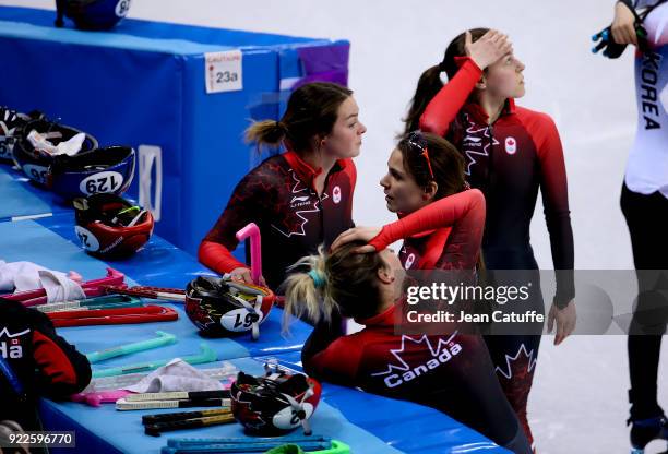 Marianne St Gelais, Kim Boutin, Valerie Maltais and Kasandra Bradette of Canada look dejected after disqualification in Short Track Speed Skating...